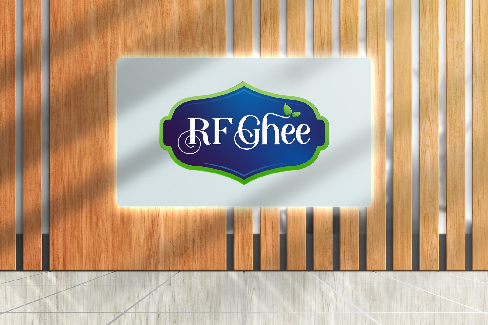 Illuminated RF Ghee logo signage mounted on a wooden wall background.